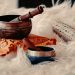 brown wooden mortar and pestle on white textile