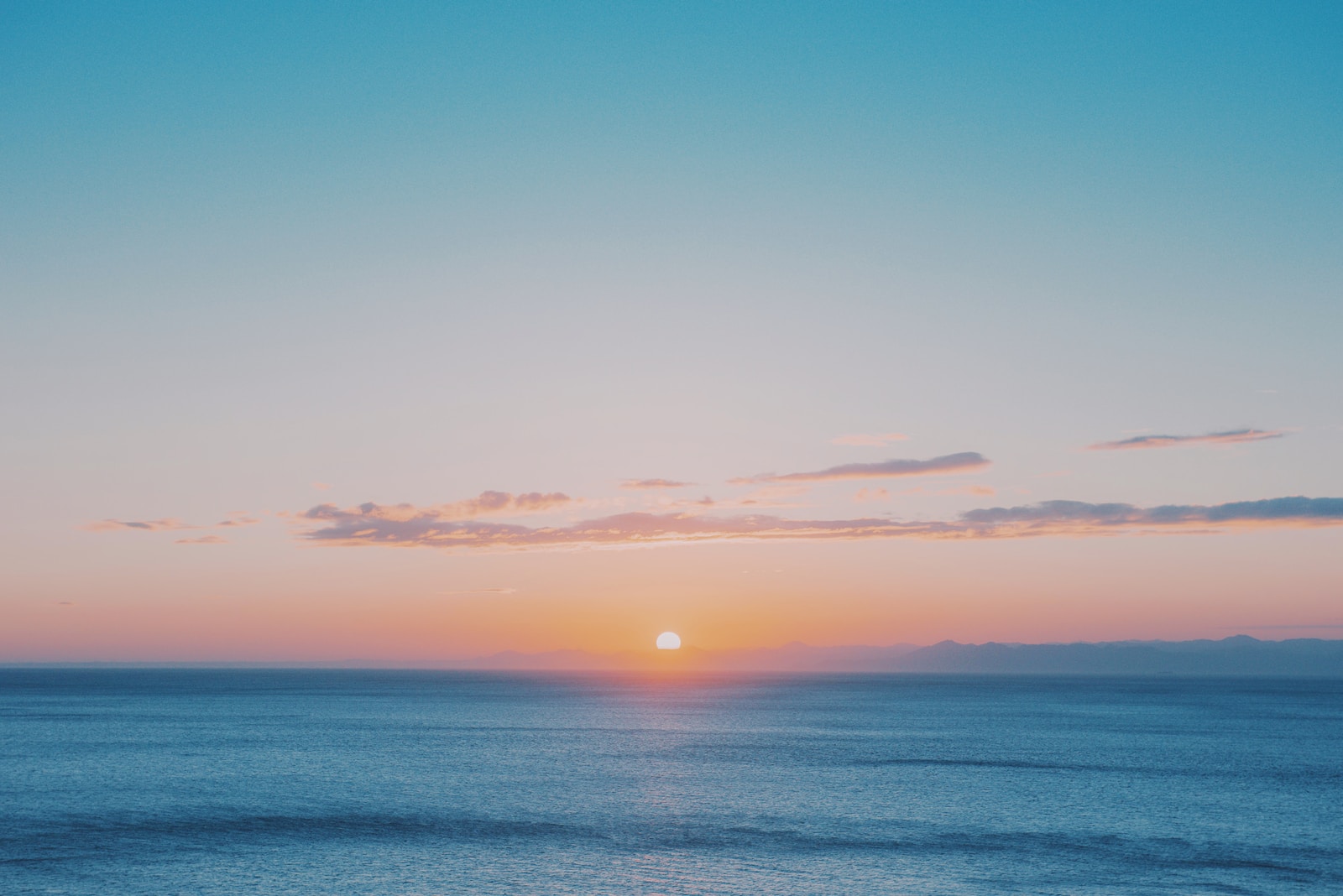 blue sea under blue sky during sunset